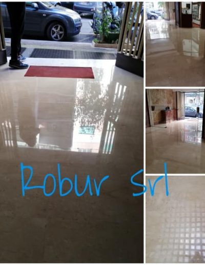 Pulizia e lucidatura marmi nell’ingresso di un condominio eseguita da Robur Servizi Srl, con pavimentazione brillante e accogliente.