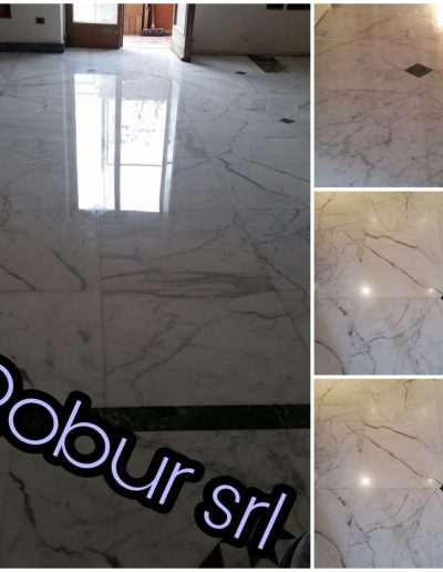 Pavimento in marmo bianco lucidato da Robur Servizi Srl con effetto specchio, risultato ottenuto grazie a un trattamento professionale di pulizia e lucidatura marmi.
