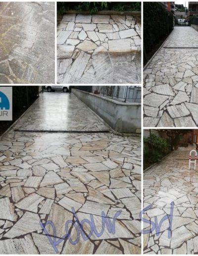 Pavimentazione esterna in pietra trattata da Robur Servizi Srl, pulizia e lucidatura per riportare la brillantezza naturale.